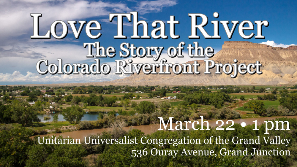 We see a portion of the Colorado River with the Bookcliffs in the background against a blue sky