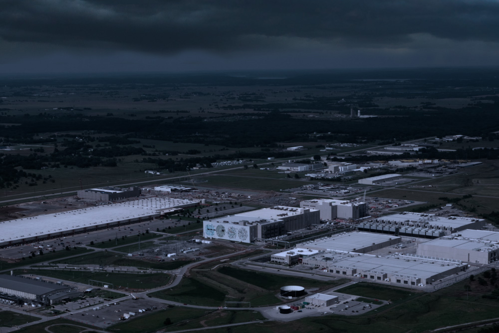 A data center is seen under brooding clouds