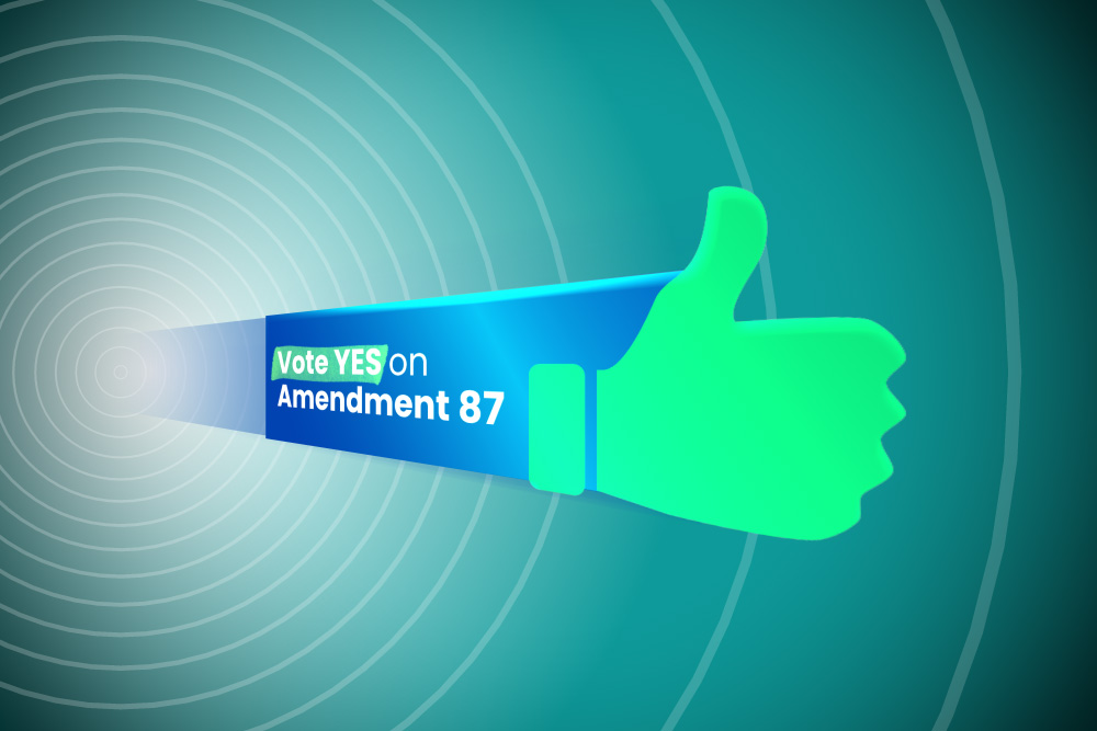 A blue bar with text reading "YES on Amendment 87" and with a hand doing a thumb's up gesture