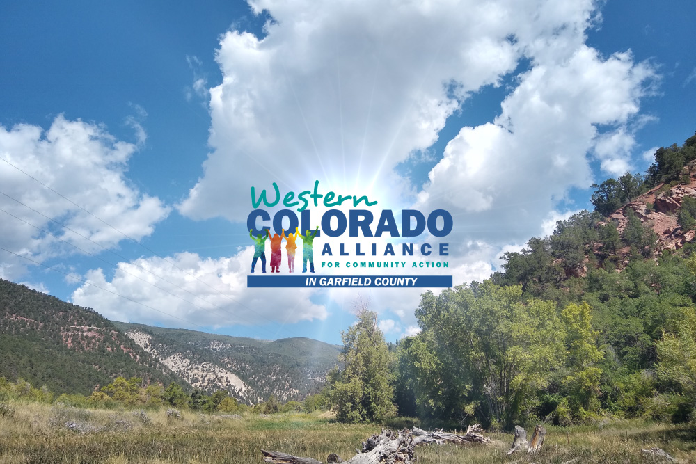 A scenic shot of Garfield County with the Western Colorado Alliance of Garfield County logo superimposed above